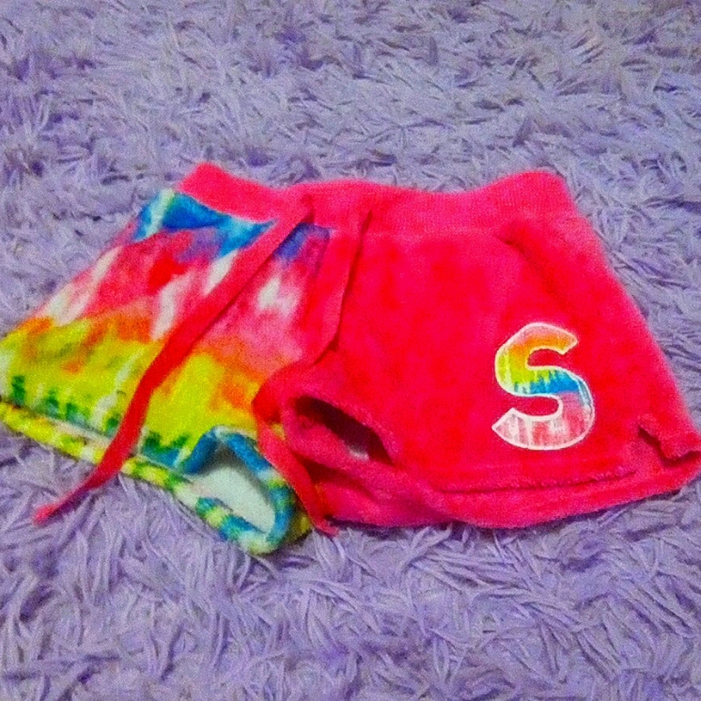 Kids size 6-7 PJ bottoms half pink half multi-colored with S on them.